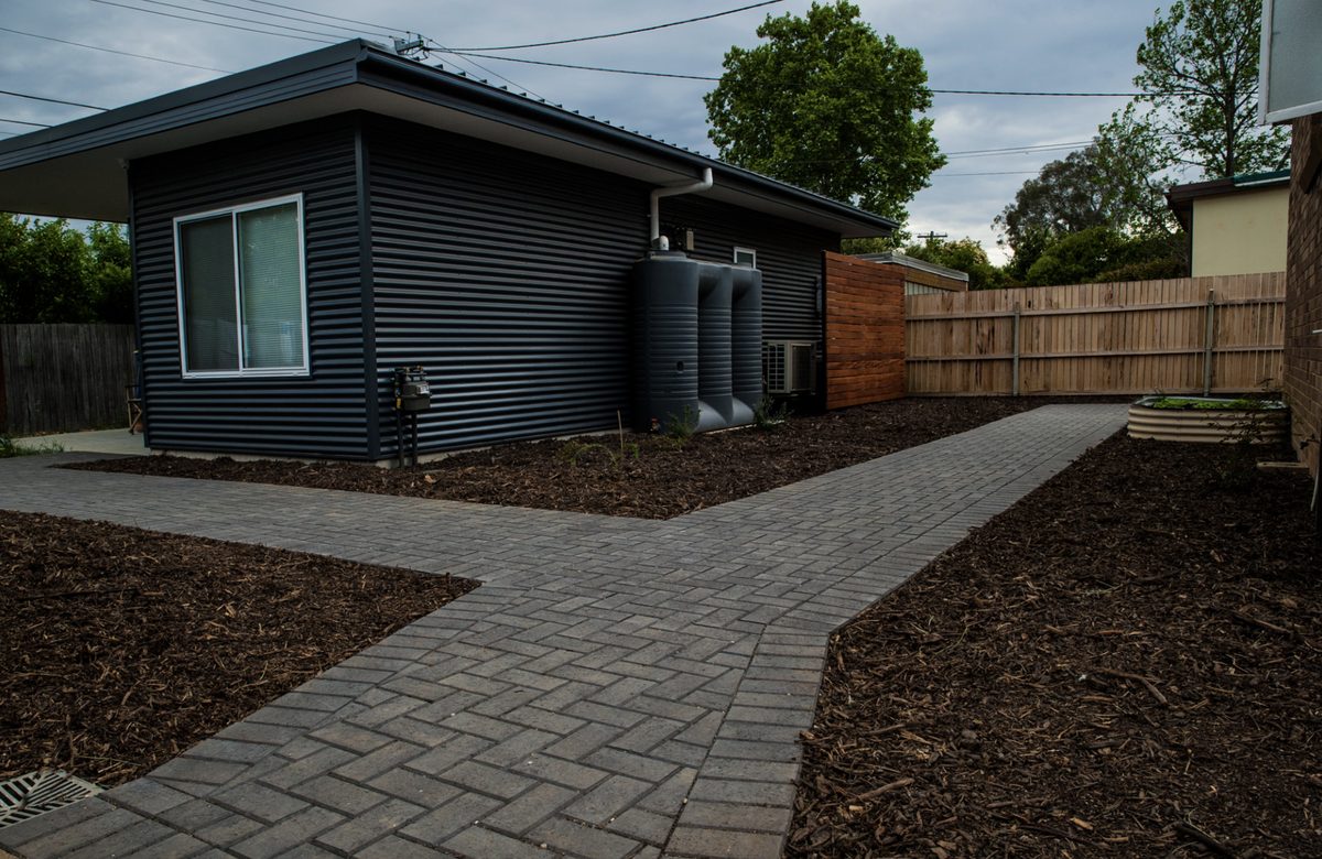 Herringbone paved path and garden beds