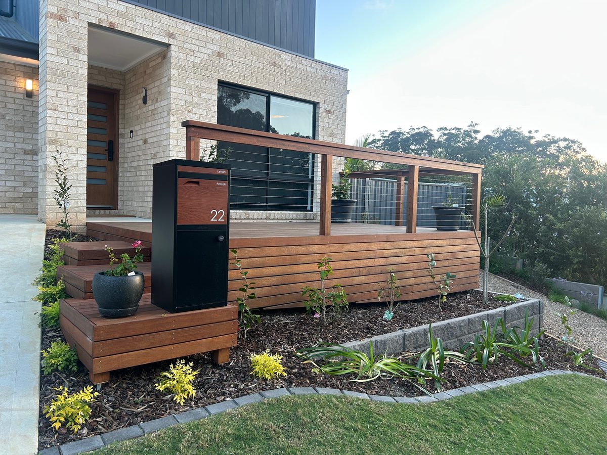 Timber deck, letterbox and garden beds at Long Beach